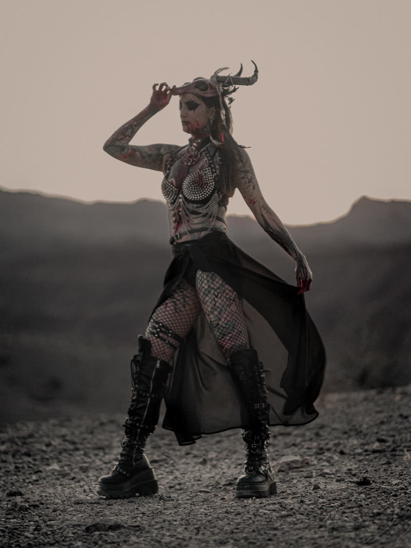 Standing in horns and veil on the open ground