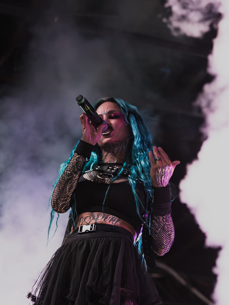 Vocalist silhouetted against a blown-out white backlight
