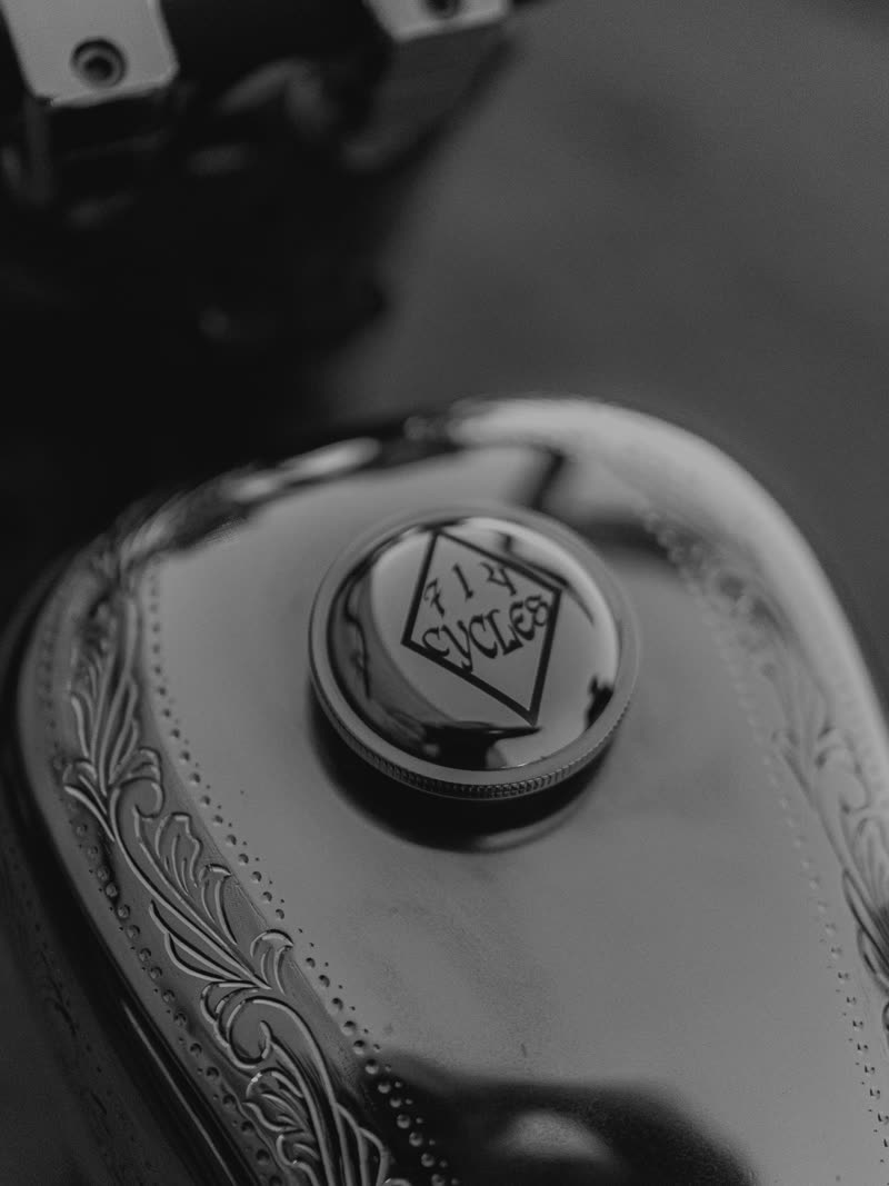 Engraved 714 Cycles filler cap on the tank, black and white