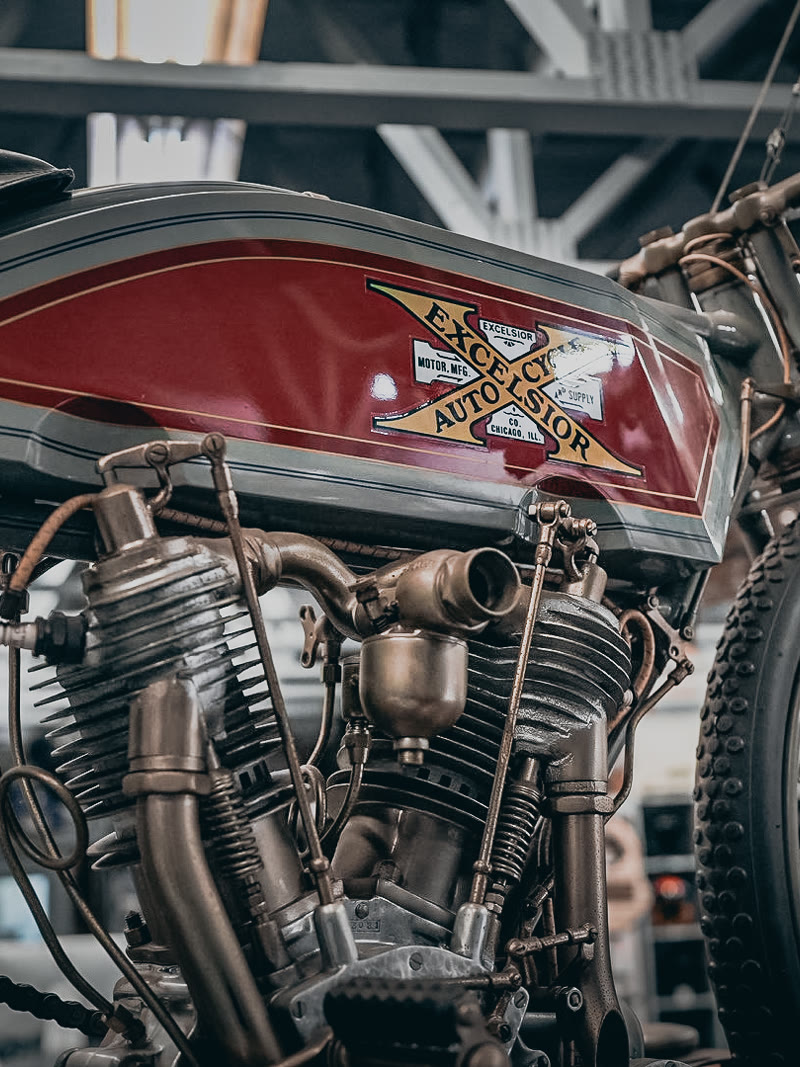 A board track racer standing on the shop floor