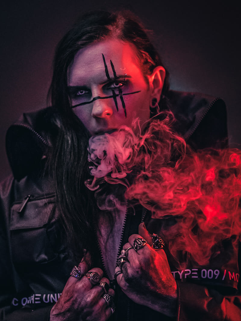 William of Uncompliant lit red through smoke