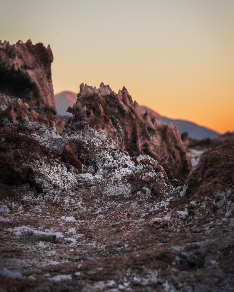 Ridged salt crust running out under orange light