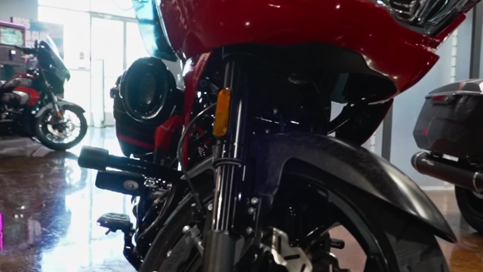 The orange CVO Road Glide ST on the showroom floor