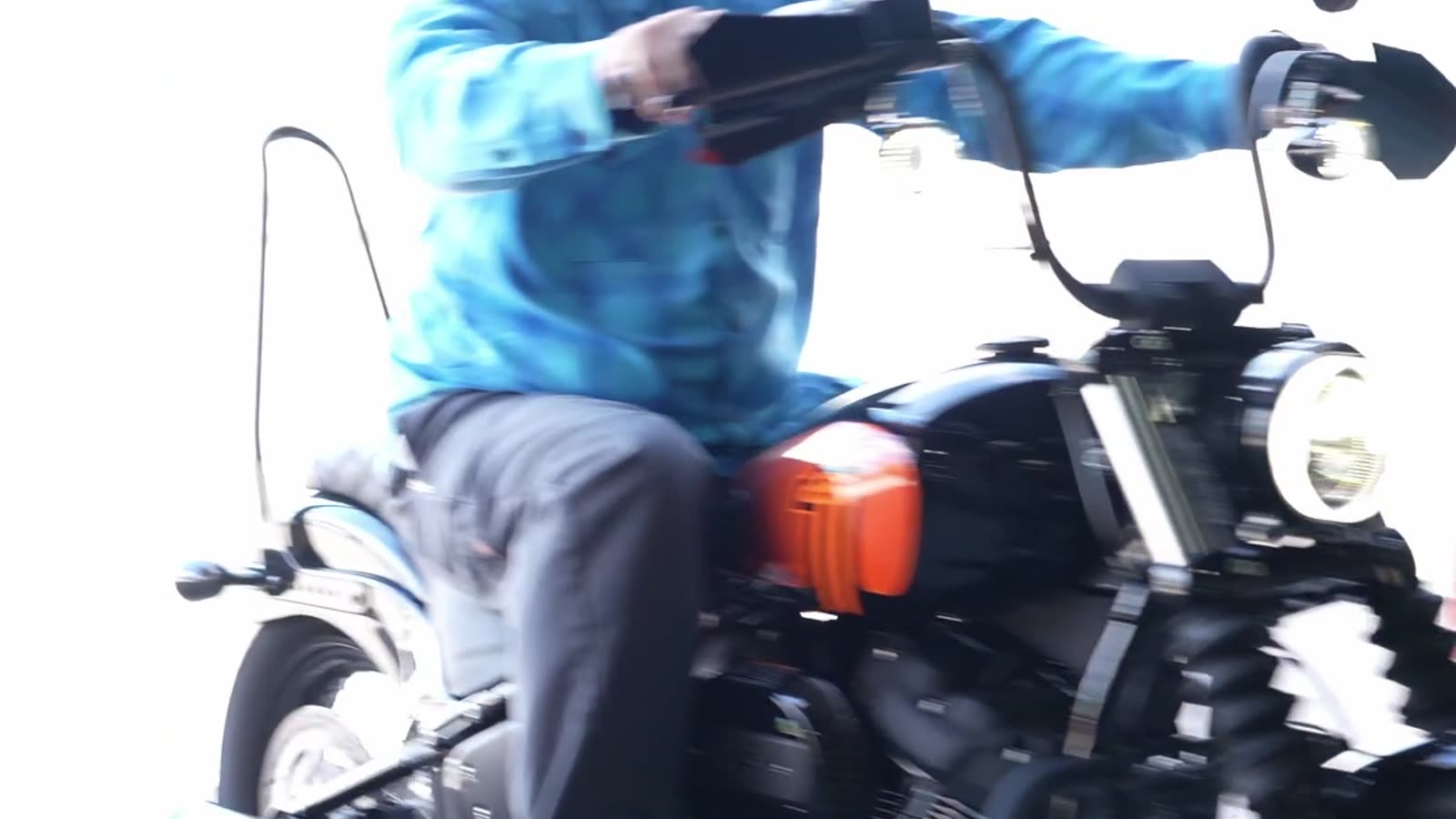 A bike on the dyno with the shop door open behind it