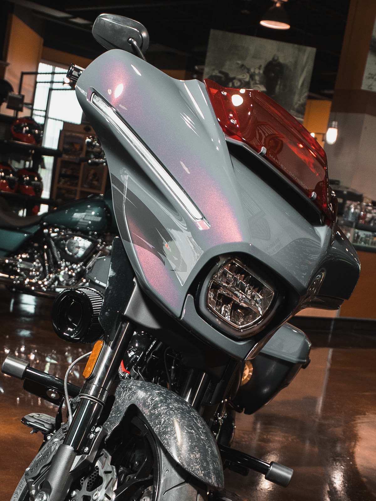 The gray CVO Street Glide ST head on, fairing and headlight lit
