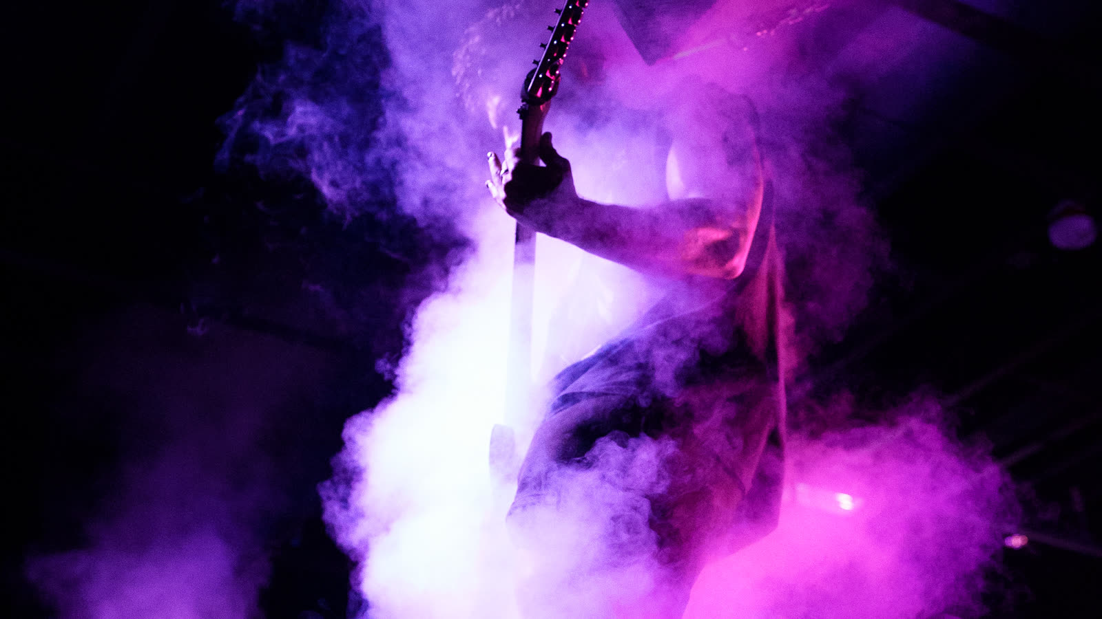 A wall of magenta smoke across the whole stage
