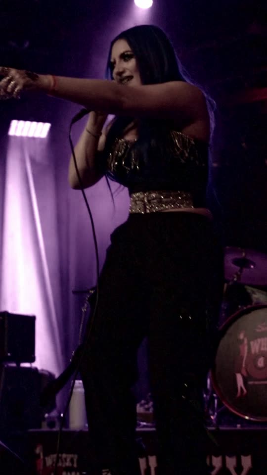The band under magenta light