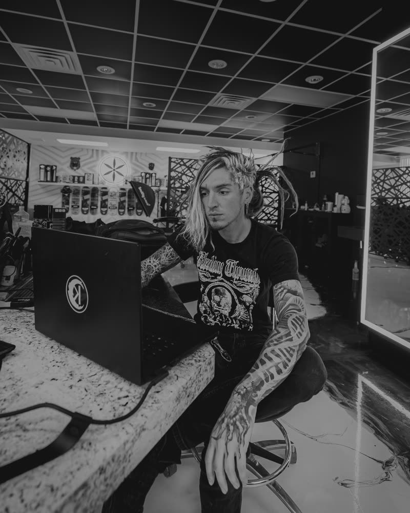 Ilya at the studio counter between clients