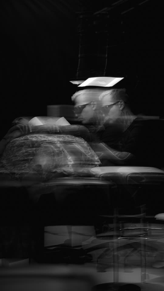 Long exposure of the booth, the artist smeared into the room