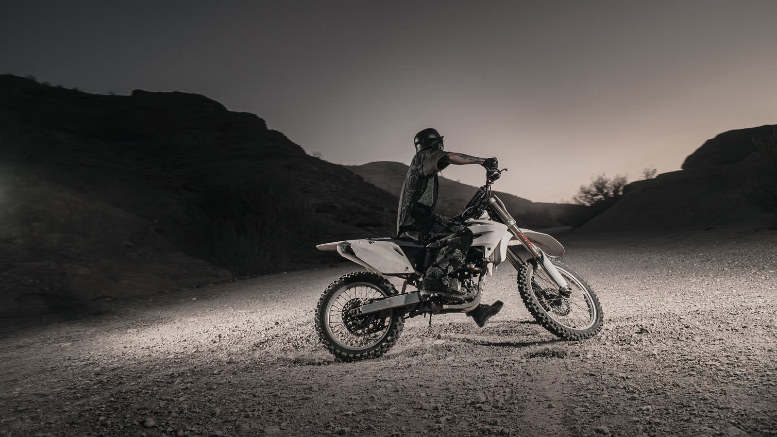 Last frame of the day, the bike small against the canyon wall