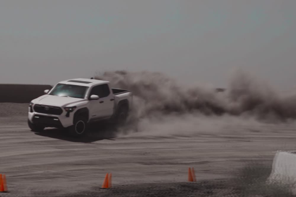 The truck mid-run across open desert