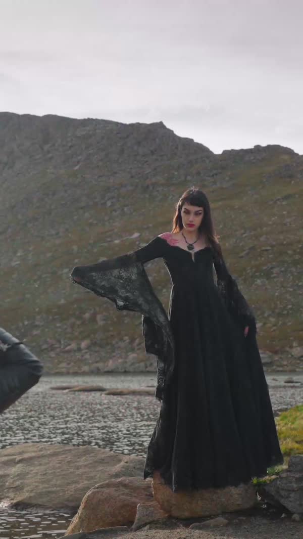 Bete Noire, black gown on the rocks of an alpine lake in Colorado