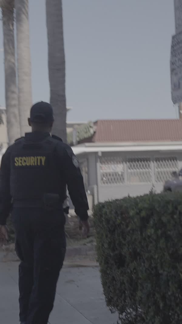 Security officer walking a beat in daylight